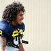 Michigan fullback Sione Houma smiles during warm ups on the practice field outside of the Al Glick Field House on Thursday, August 8, 2013. Melanie Maxwell | AnnArbor.com 